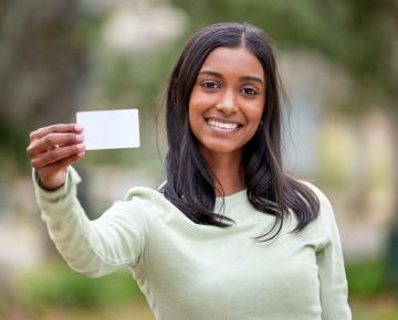 Student holding ID