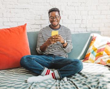 person in dorm on phone